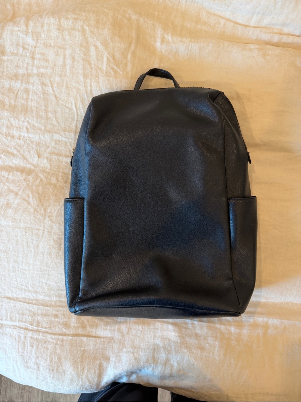 Black Minimalist Backpack with gold detail
